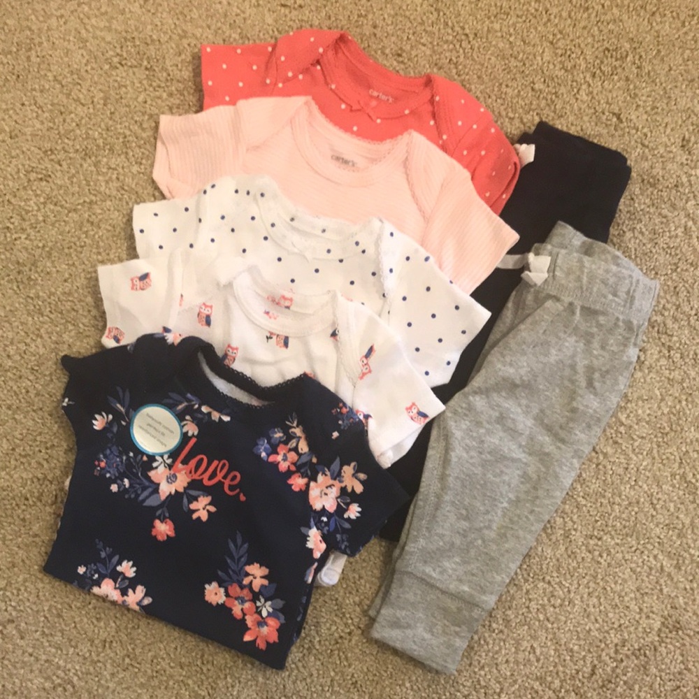 Five onesies and two pants for baby girl